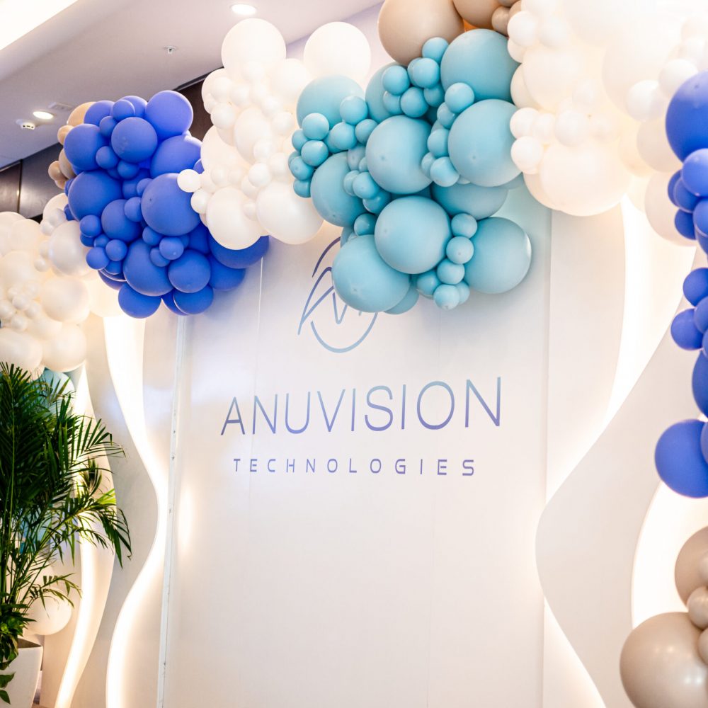 AnuVision Technologies showroom entrance with branded display and balloon installation